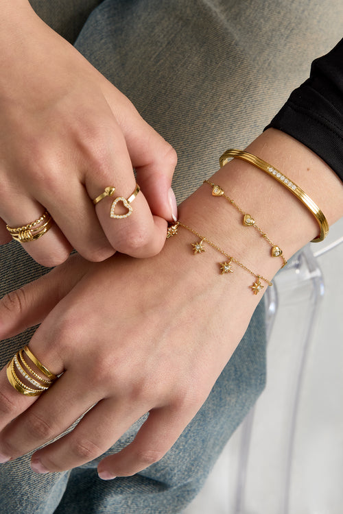 Armband met bolletjes en hartjes met steen